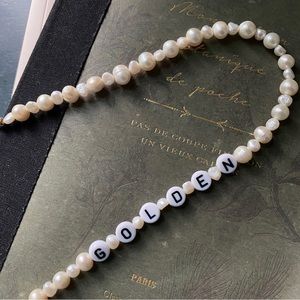 Freshwater pearl necklace with “GOLDEN” in letters